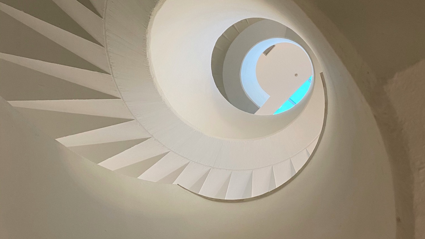 Spiral staircase viewed from below — layers of abstraction